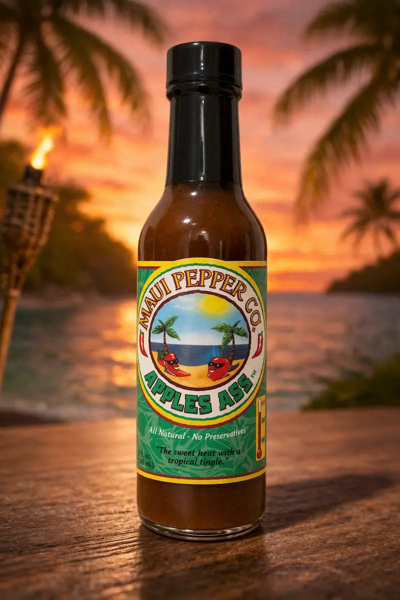 Maui Pepper Co. Apple's Ape hot sauce bottle with a sunset and beach background