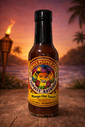 Bottle of Mango Hot Sauce with a tropical background
