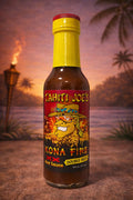 Bottle of Tahiti Joe's Kona Fire hot sauce with a tropical background