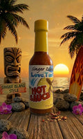 Bottle of Singer Island Love Turtles Hot Sauce with a tropical sunset background