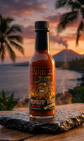 Bottle of Tahiti Joe's hot sauce with a sunset and beach background