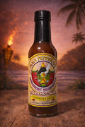 Hot sauce bottle with a tropical background